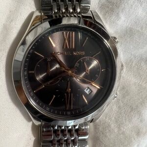 Michael Kors stainless steel women’s watch with black face and rose gold accent